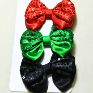 Set of Christmas hair clips with red, green, and black sequin bows