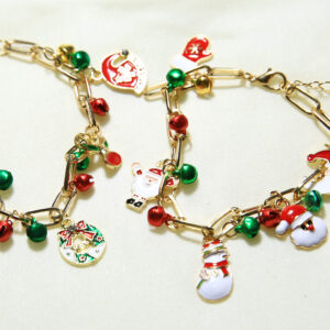 Metal bracelet with Christmas-themed charm pendants