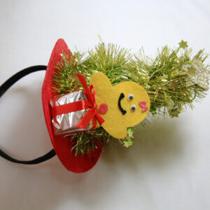 Cute Christmas headband with gingerbread man, gift box, and festive tinsel decorations